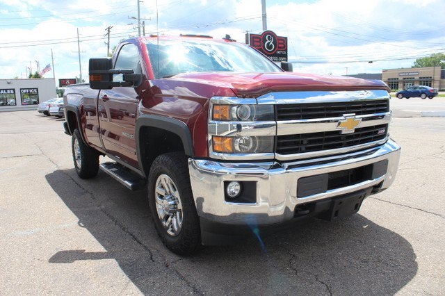 2016 Chevrolet Silverado 2500HD LT in Siren Red Tintcoat — front three-quarter view