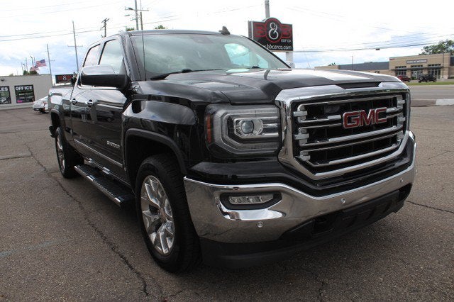 2016 GMC Sierra 1500 SLT in Onyx Black — front three-quarter view