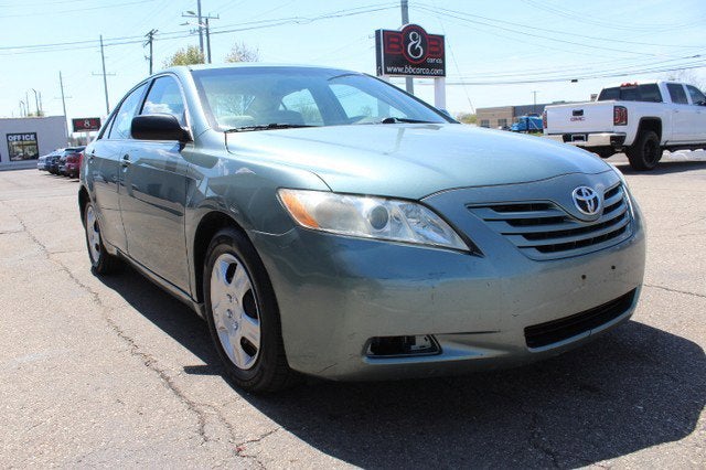 2009 Toyota Camry LE in Green — front three-quarter view